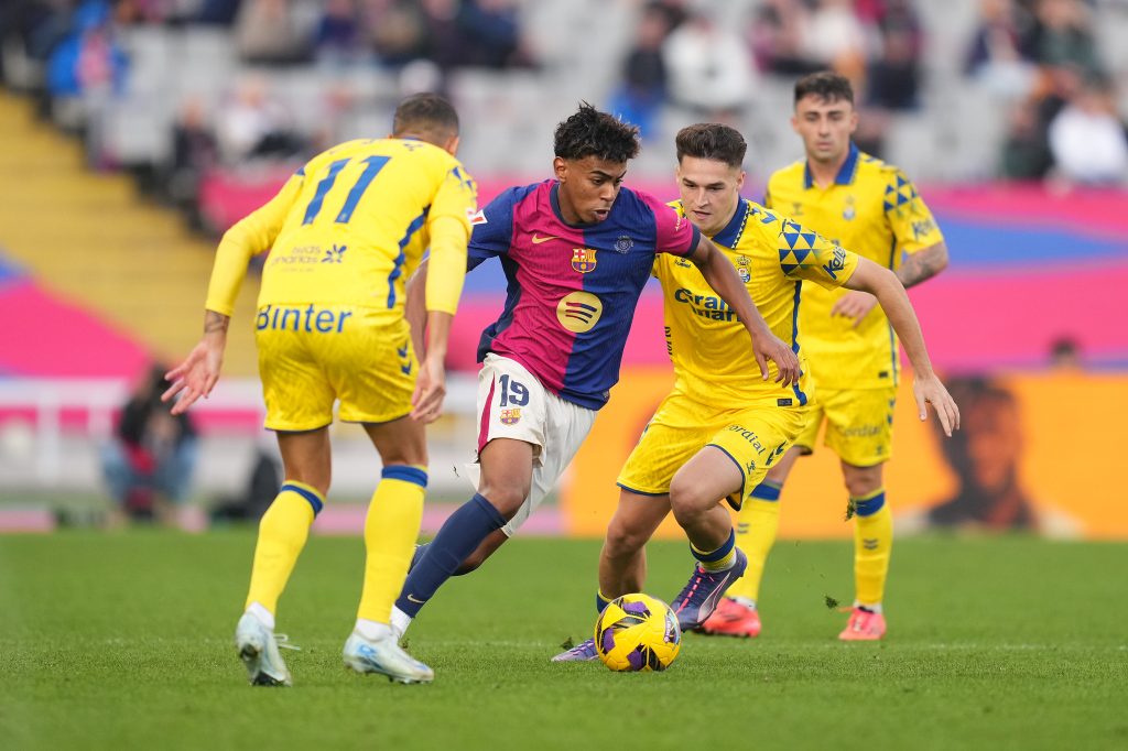 Lamine Yamal of FC Barcelona and Mika Marmol of UD Las Palmas