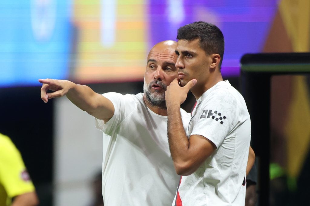 Pep Guardiola and Rodri of Manchester City